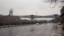 وضعیت قرمز کیفیت هوای تهران در یک روز بارانی